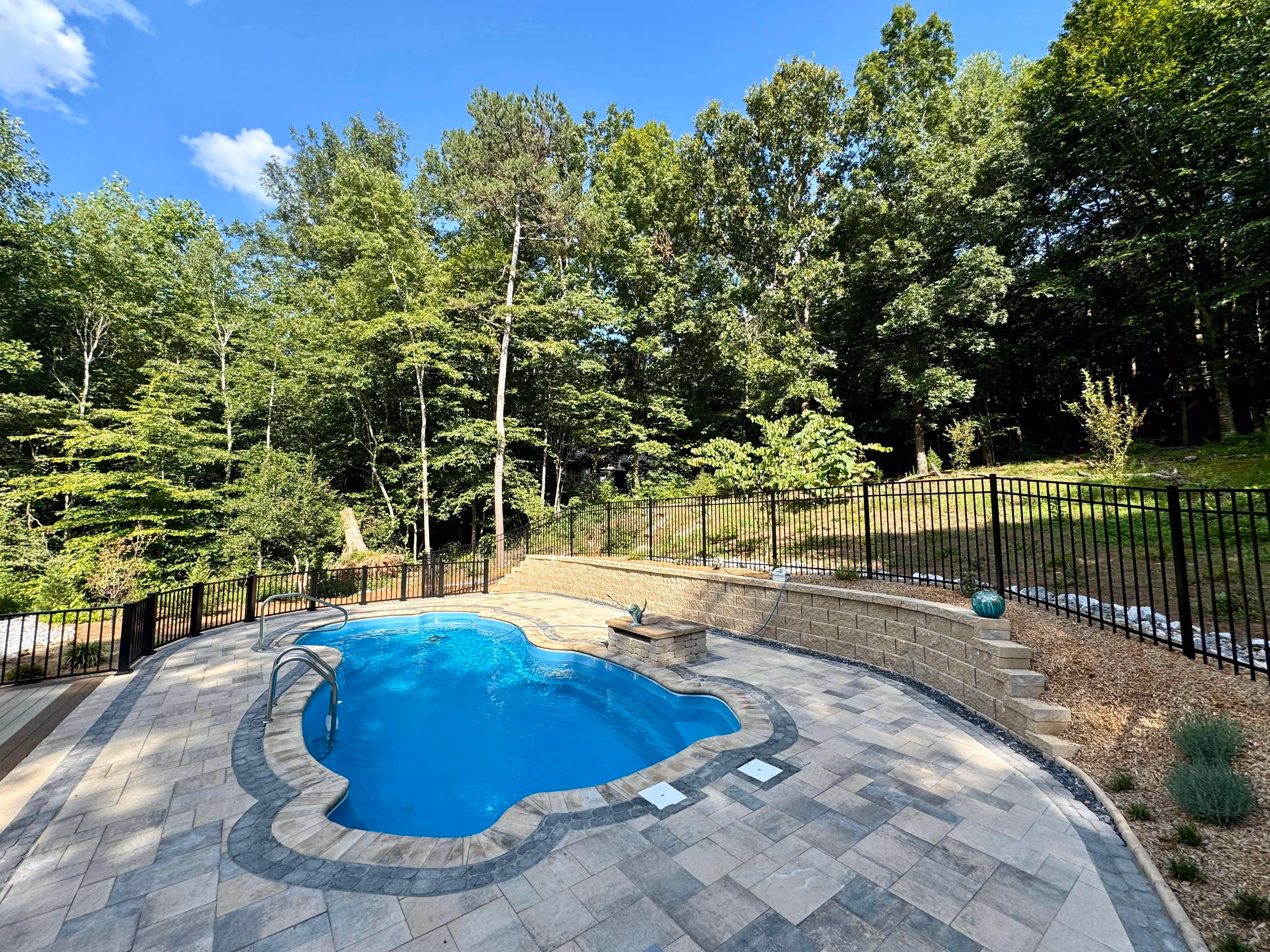 Paver patio surrounding in-ground pool