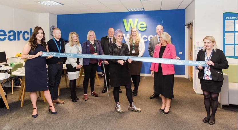 Angela Constance MSP, cutting the ribbon at the new Livingston office