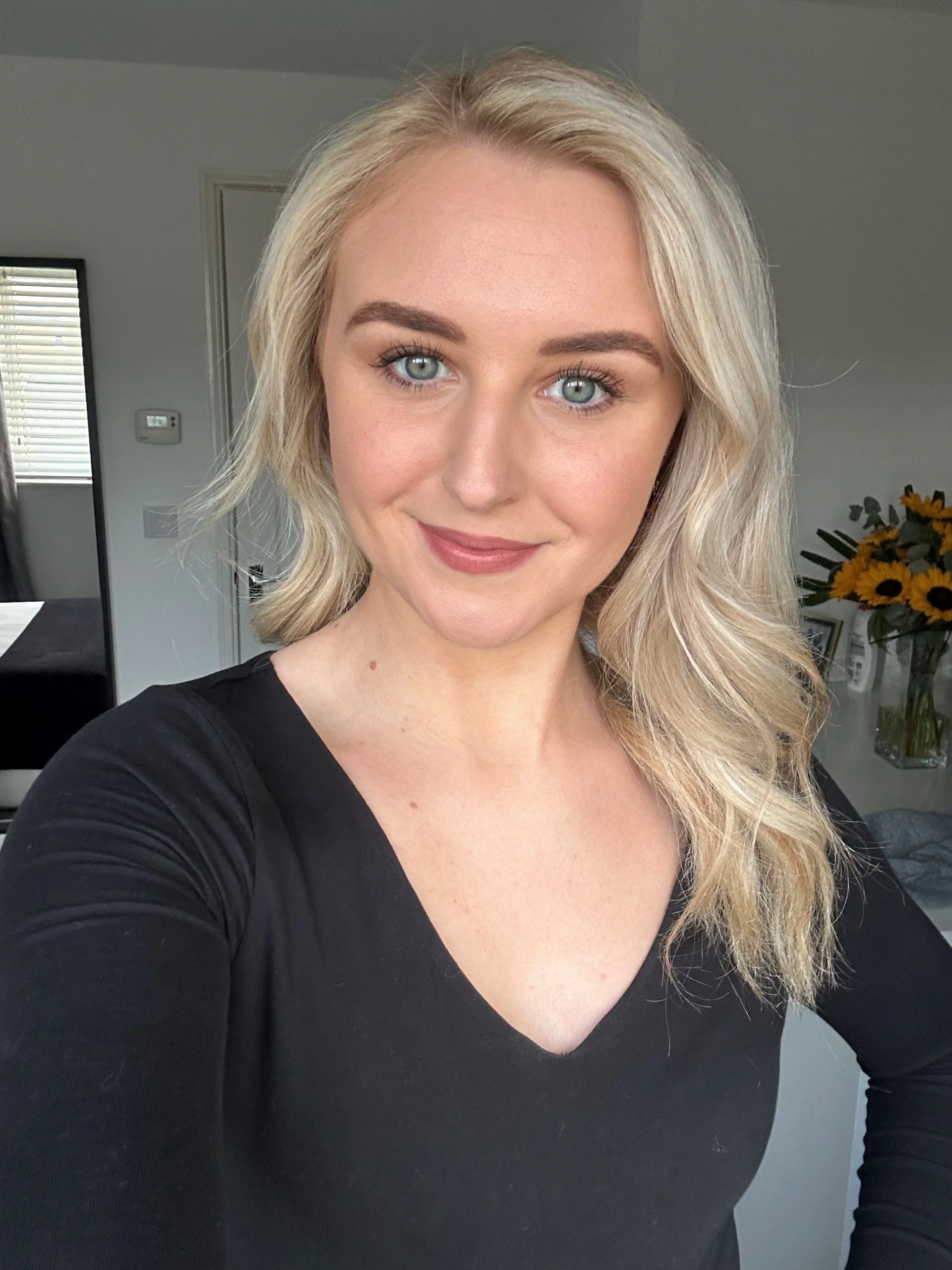 Portrait of Becky-Ann, L&D Business Partner, with long blonde hair.