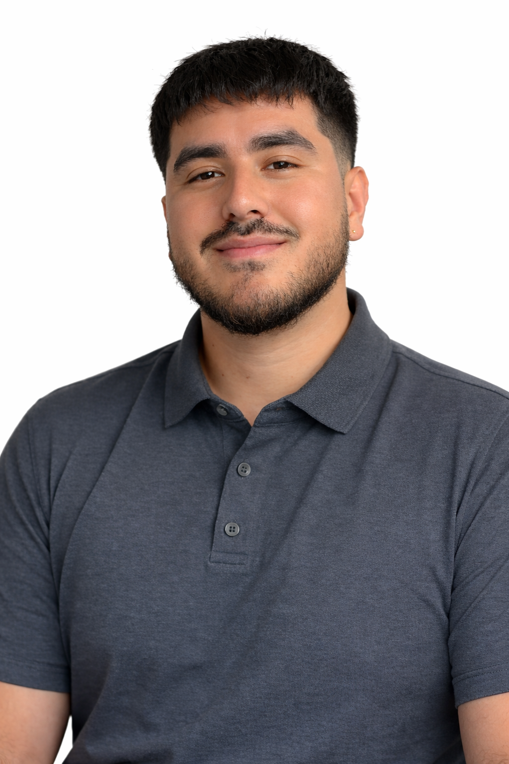 Smiling young man with short black hair, beard, and mustache wearing a dark gray polo shirt against a white background.