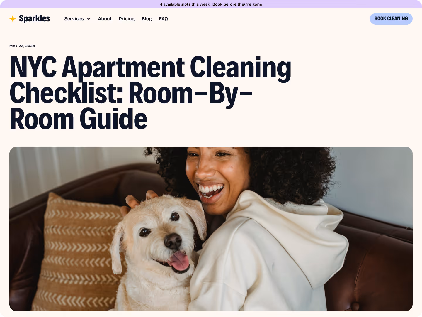 Smiling woman in white hoodie hugging a happy dog on a brown couch with patterned pillows.