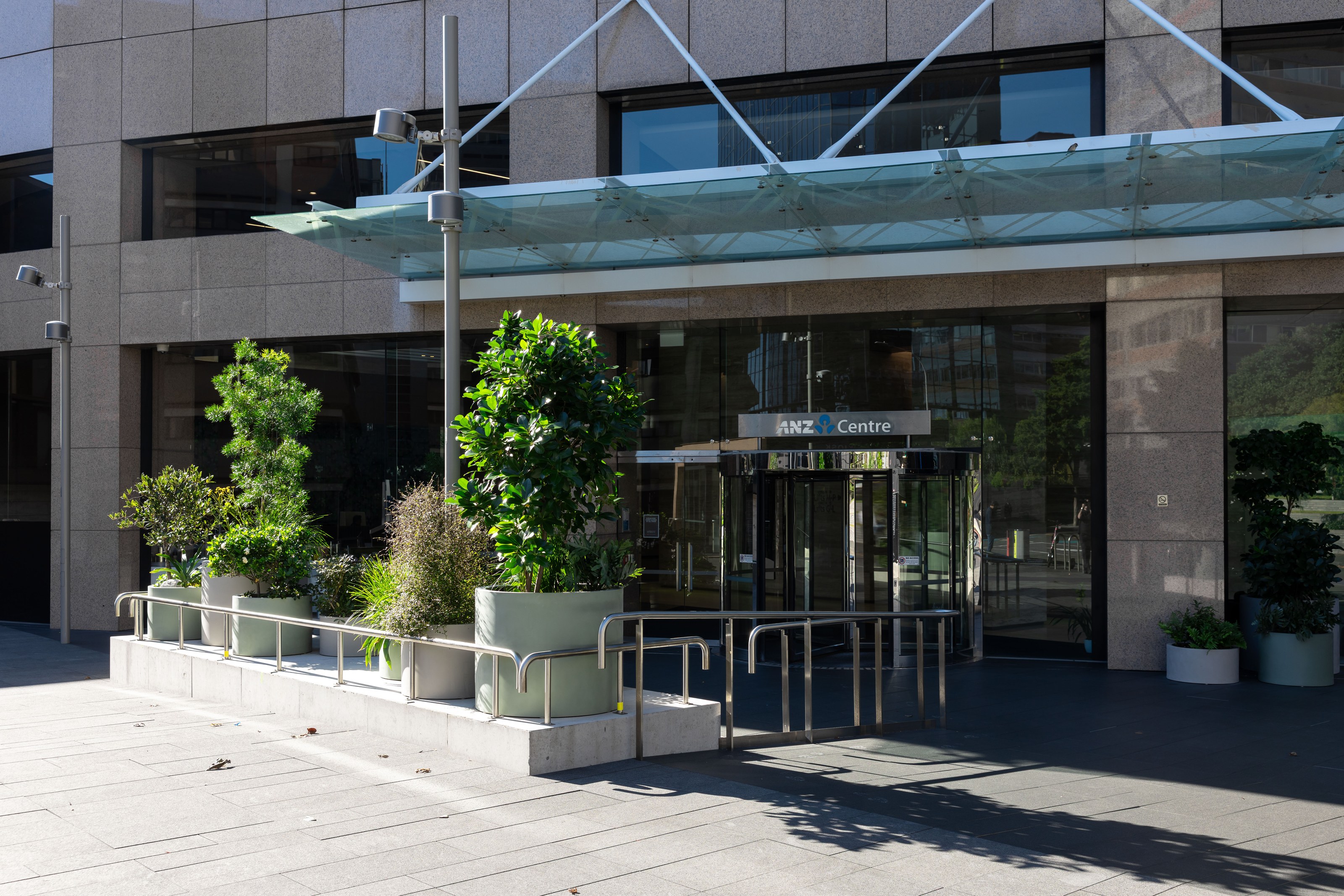 GreenAir planters framing the ANZ Centre Auckland entrance, bringing greenery to the building's street-level arrival