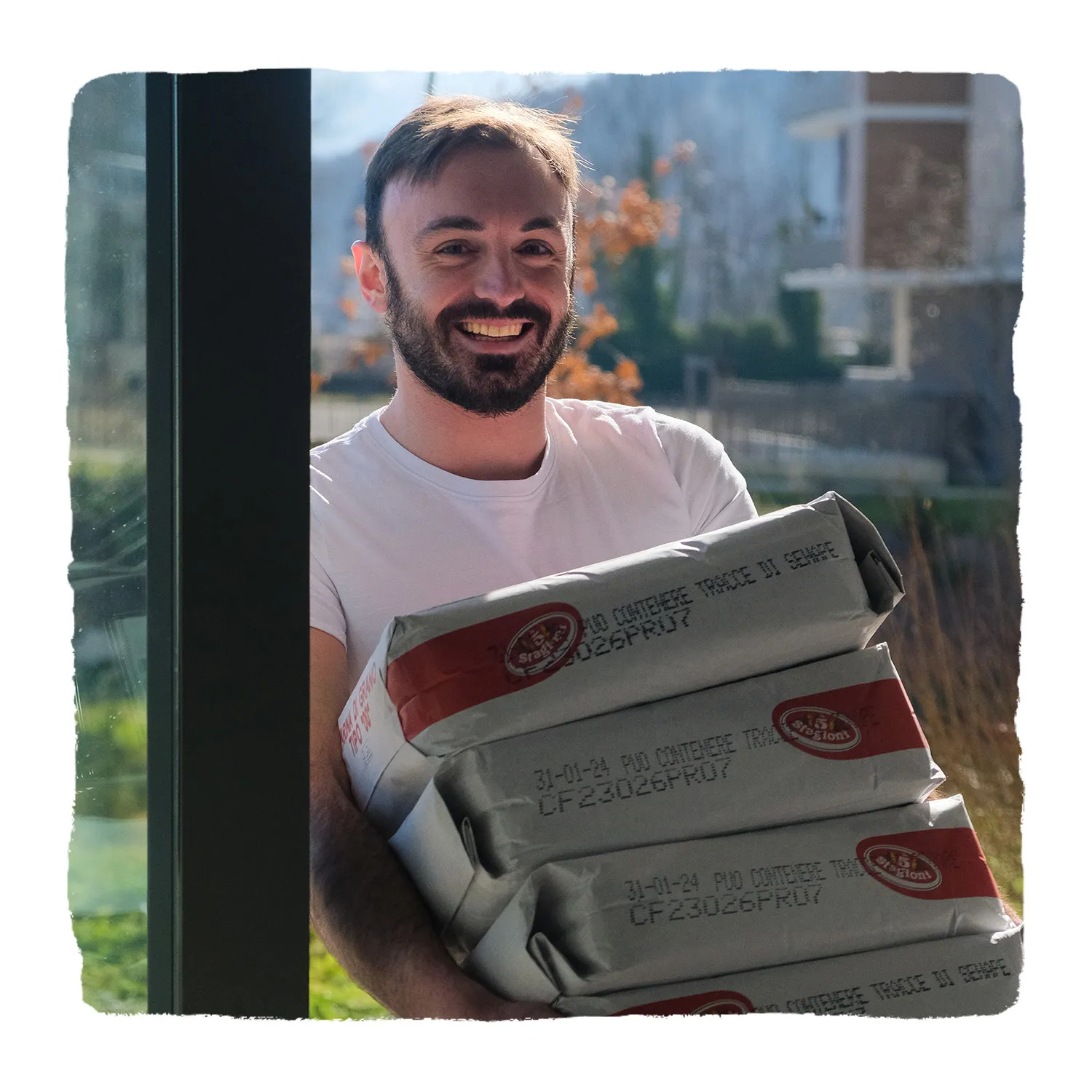 man holding flour bags