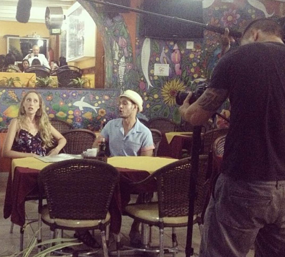 Harry filming a conversation in Brazil, with the camera crew