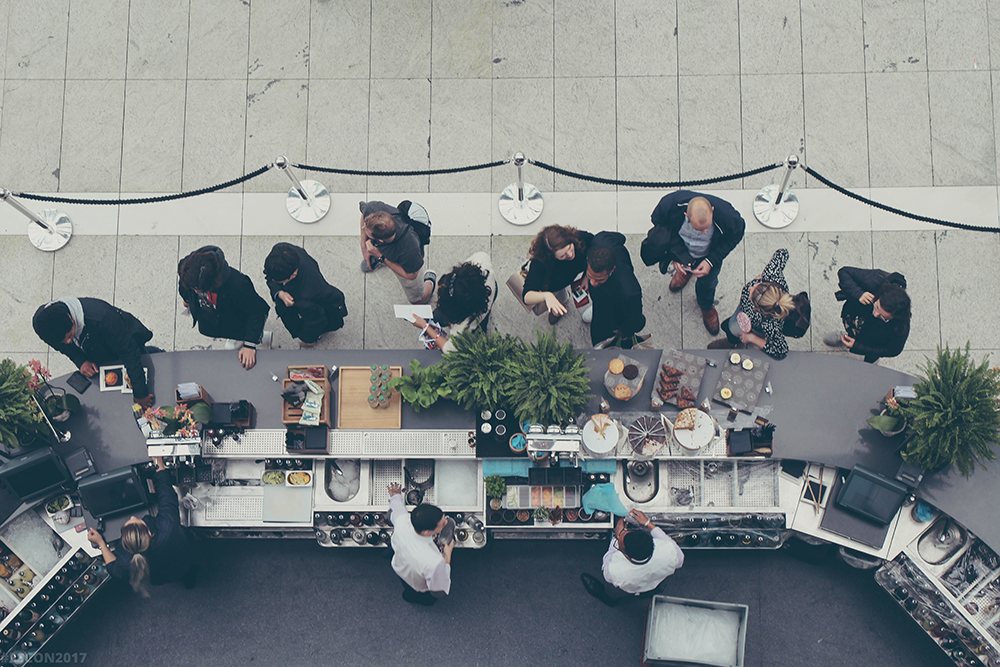 A group of young professionals at a bar, event planning jobs