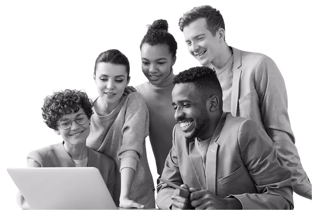 Group of five diverse young professionals smiling and looking at a laptop together.