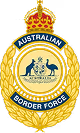 Australian Border Force emblem with a crown, kangaroo and emu, and a golden wreath surrounding the shield.
