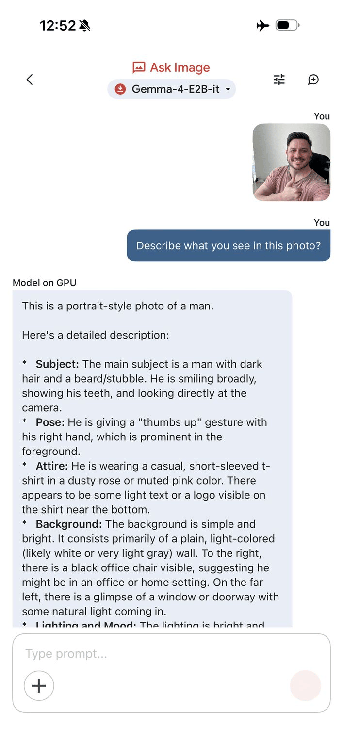 Phone screenshot of Gemma 4 running on-device, describing a selfie of a smiling man giving a thumbs up