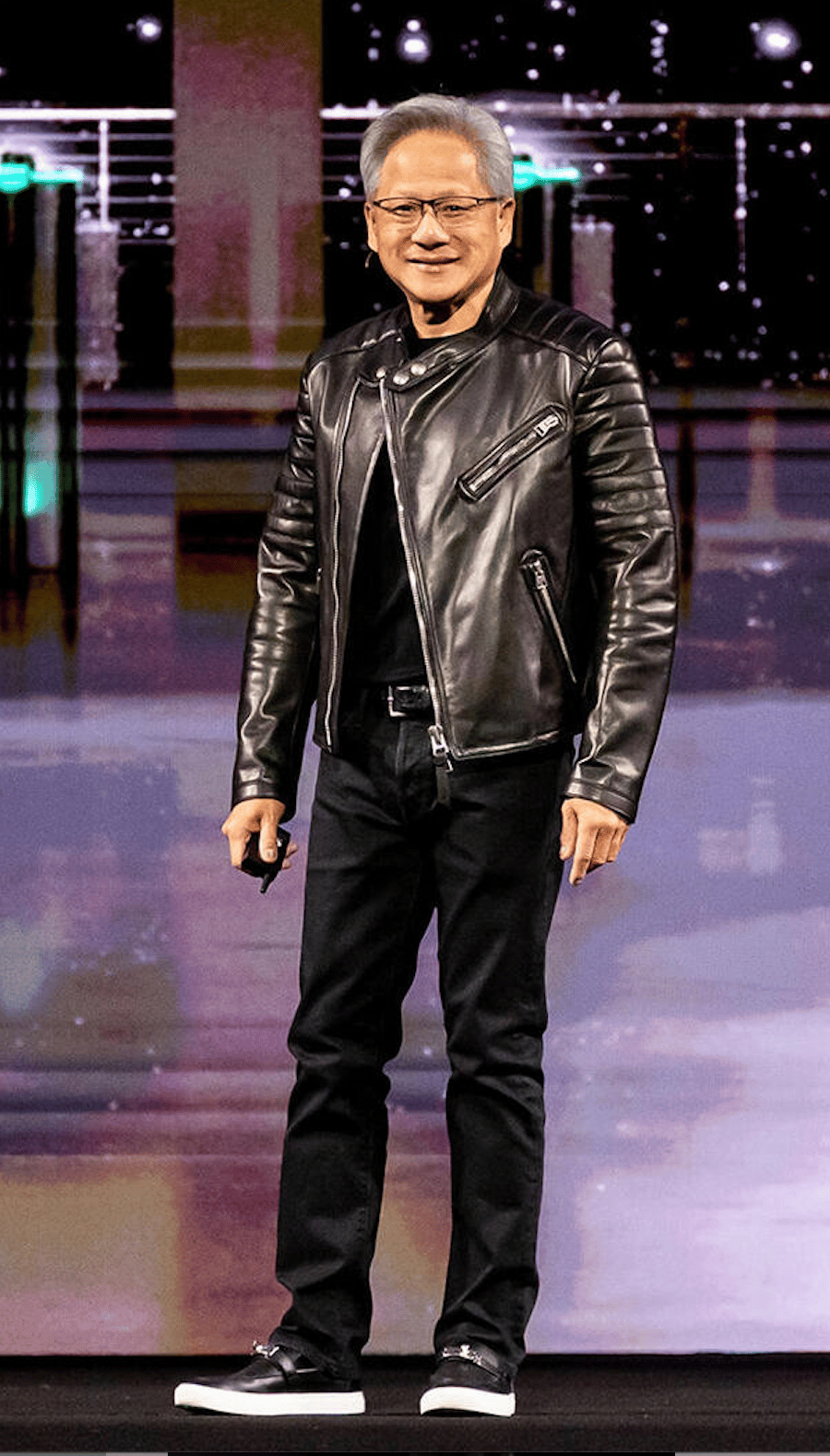 Input photo: man on stage in a black leather jacket, black T-shirt, jeans and black trainers
