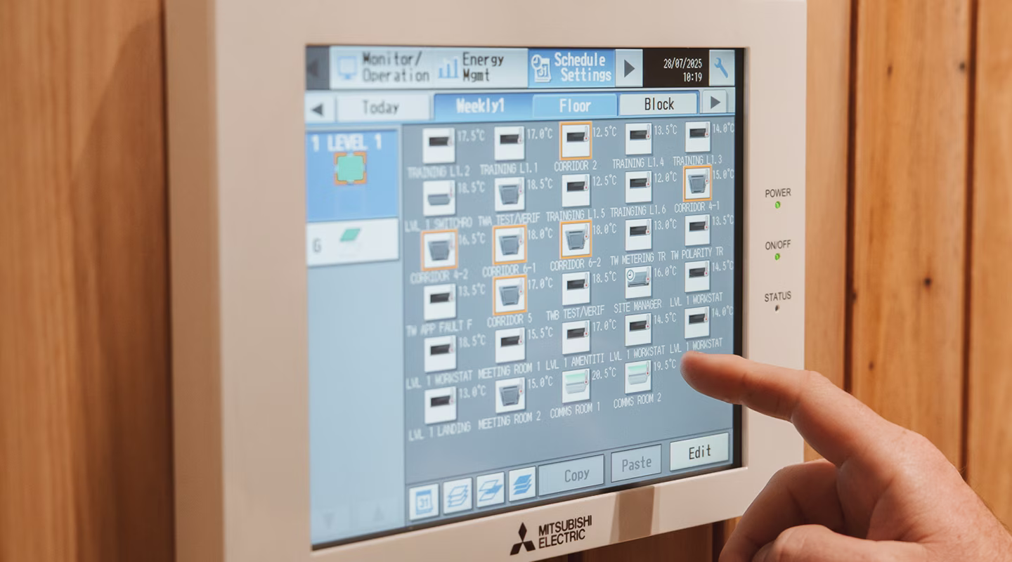 Mitsubishi Electric BMS touchscreen controller displaying HVAC zone layout
