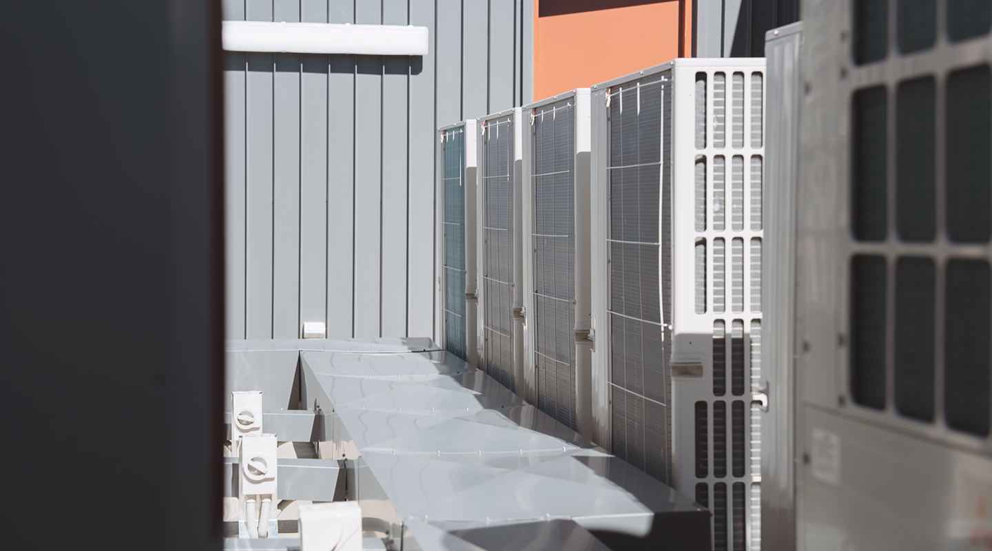 Commercial ducted air conditioning units installed on a building exterior