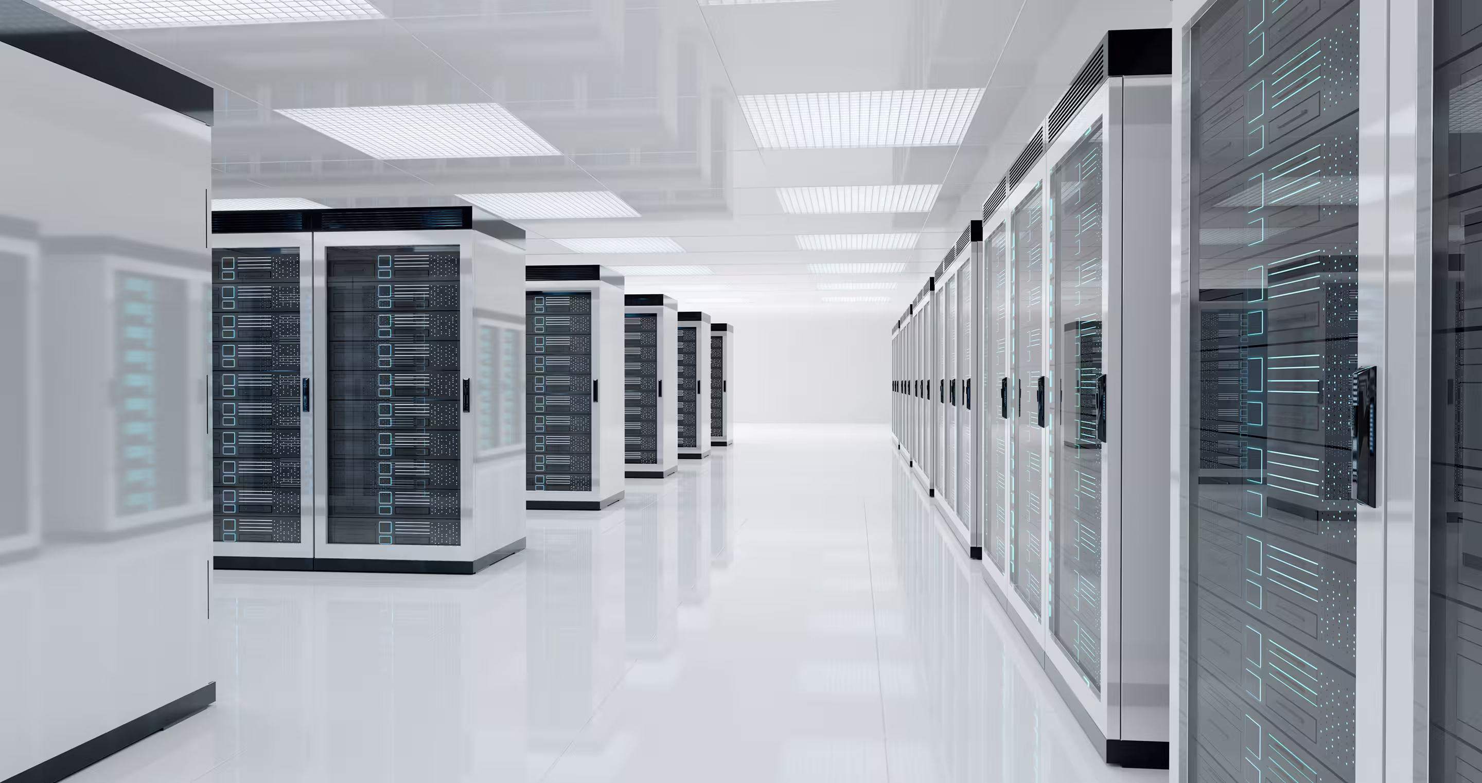 Rows of server racks in a precision-cooled commercial data centre with blue LED lighting and critical cooling infrastructure