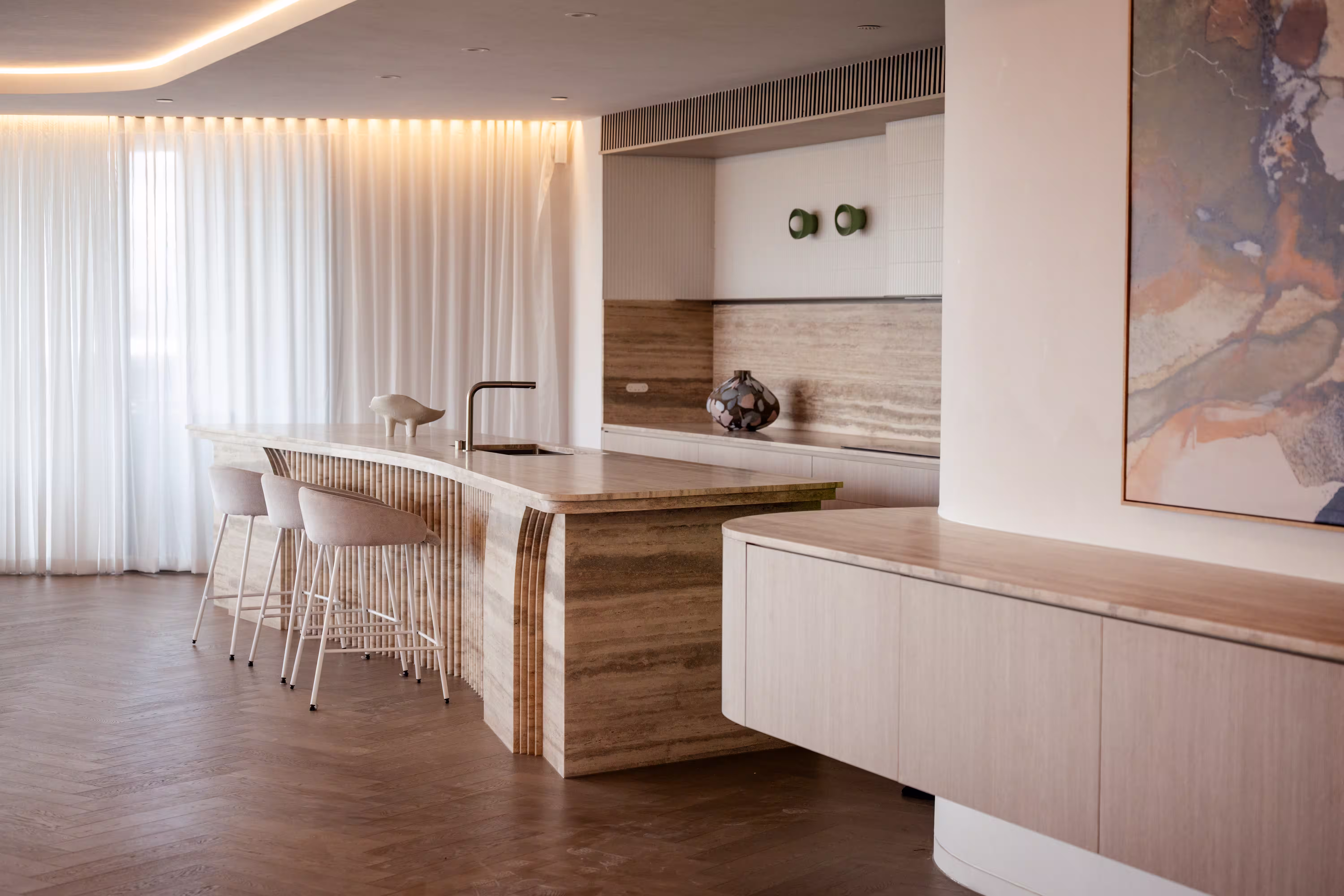 Modern commercial interior fit-out featuring a kitchen and bar area with concealed ceiling-mounted air conditioning and timber wall panelling
