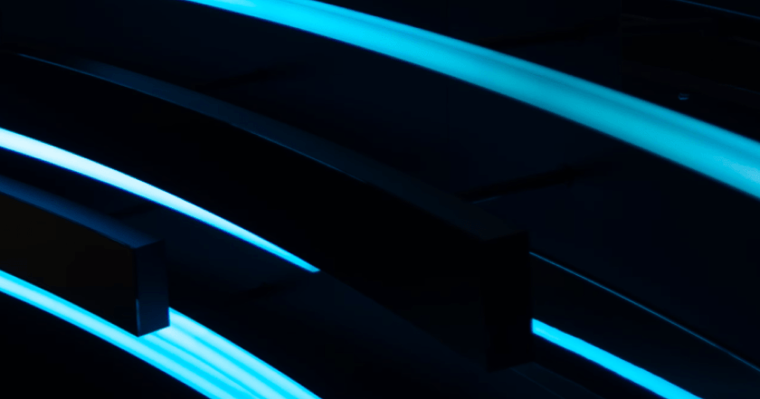 Aerial night city view with glowing blue geometric network lines overlaid on skyscraper rooftops