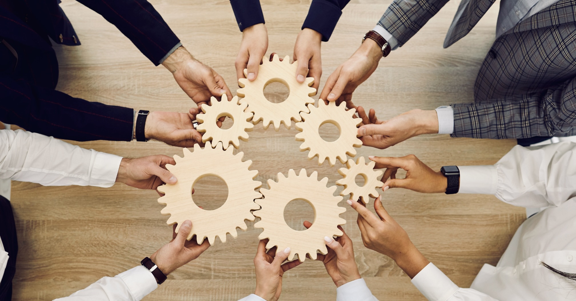 Team Work driving different cogs in the organization