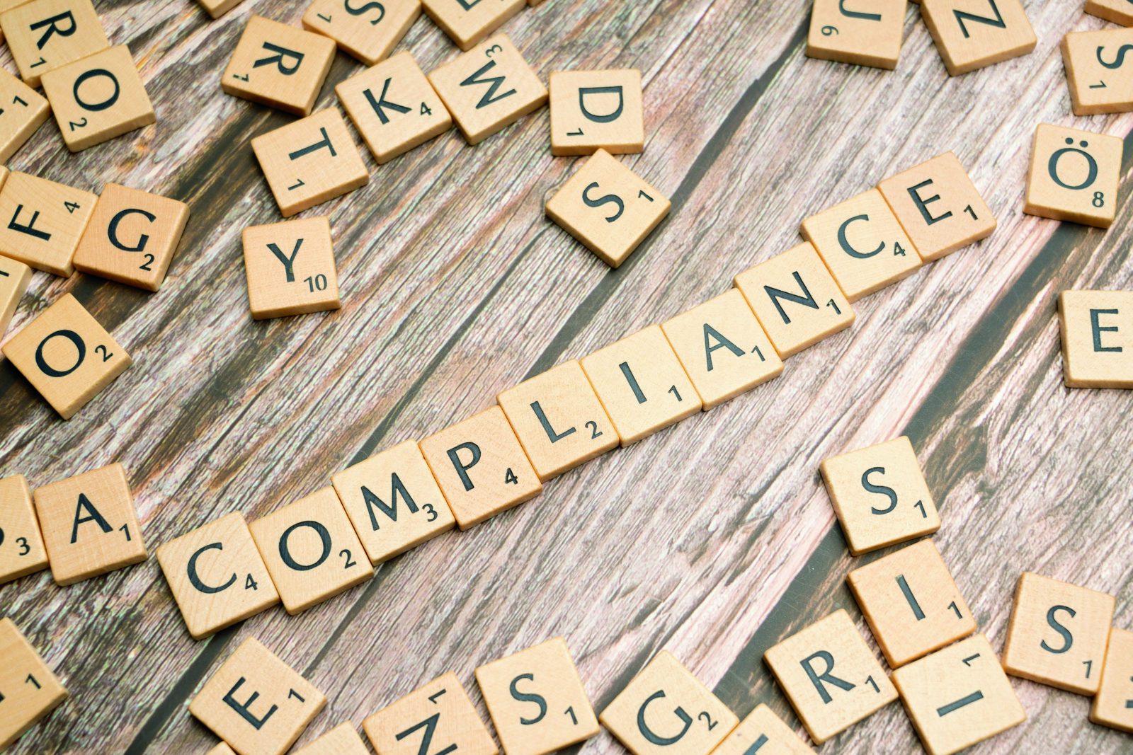 Compliance & Governance Audit - letter tiles spelling compliance