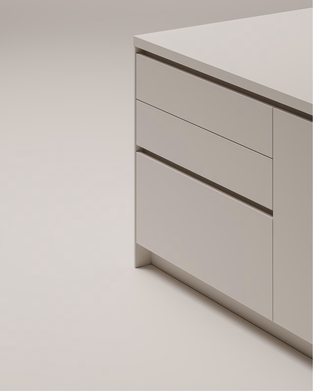 Ecke einer modernen, minimalistischen Kücheninsel mit glatten grauen Schubladen und Schranktür.