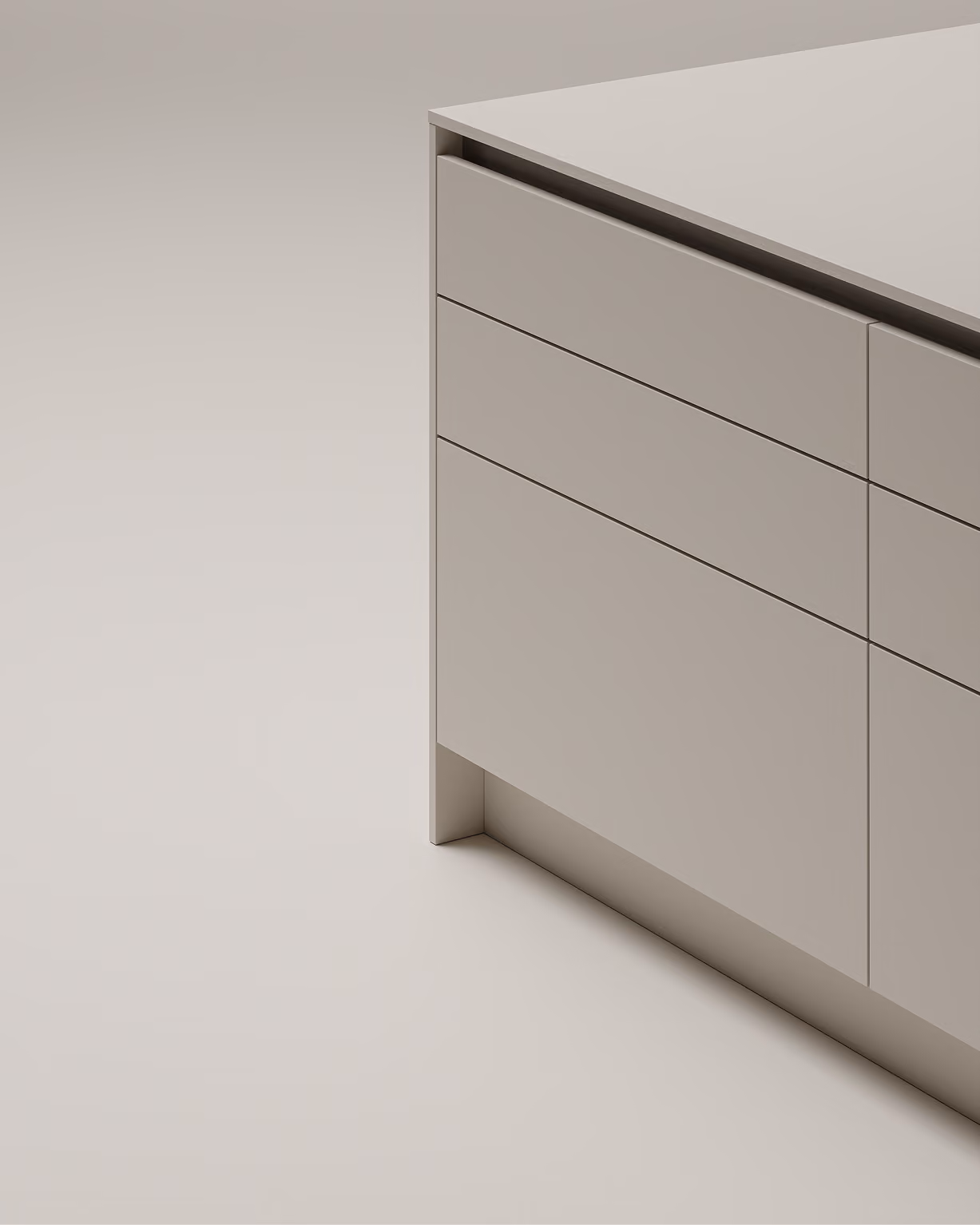 Detailansicht einer minimalistischen, beigen Kücheninsel mit Schubladen und Schranktüren.