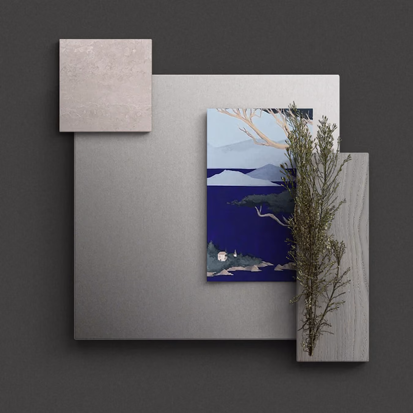 Abstrakte Anordnung von grauen Platten, einem blauen Landschaftsbild und grünen Zweigen auf dunklem Hintergrund.