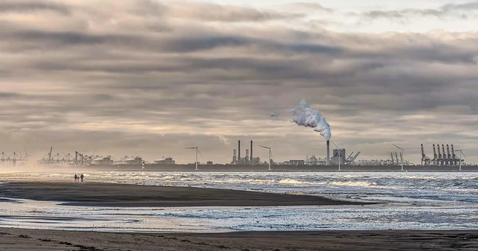 Coastline with industrial area in the background.