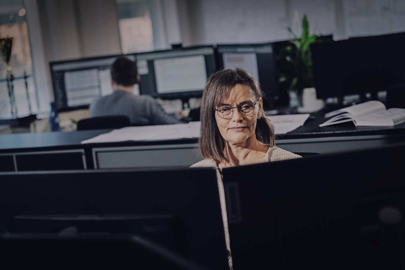 Employee in open office.