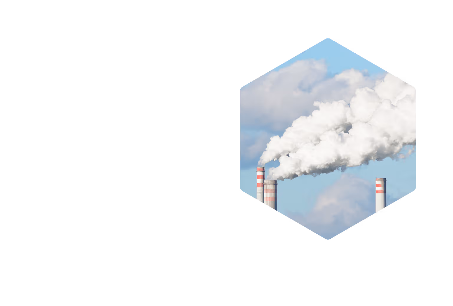 Industrial smokestacks emitting large white smoke clouds against a blue sky.