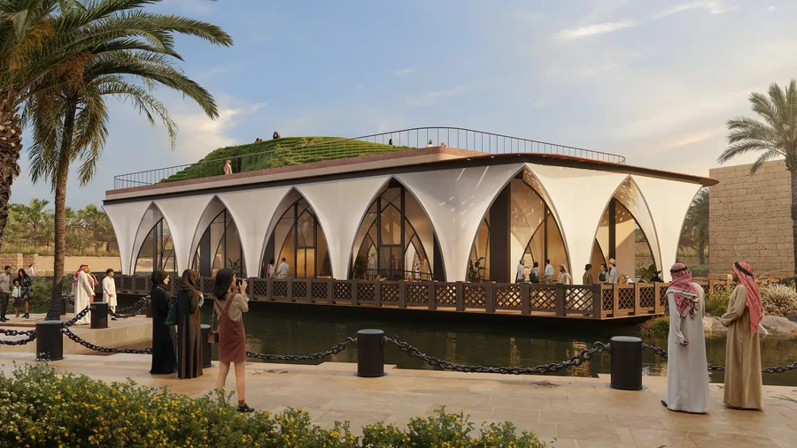 Render of the A.R.M. Majlis Pavilion by the water: white fabric arches under a planted roof.