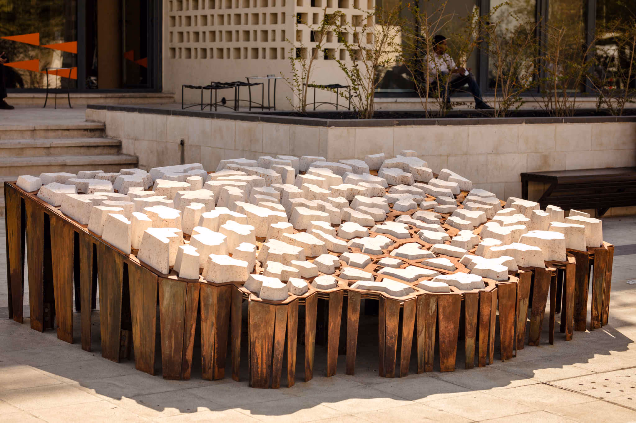 CNC-milled Jordanian stone installation representing water scarcity.