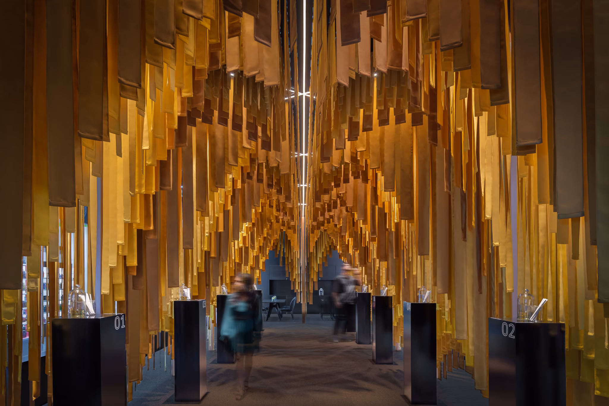 Yellow fabric modules forming the Luminescents fragrance pavilion in Dubai.
