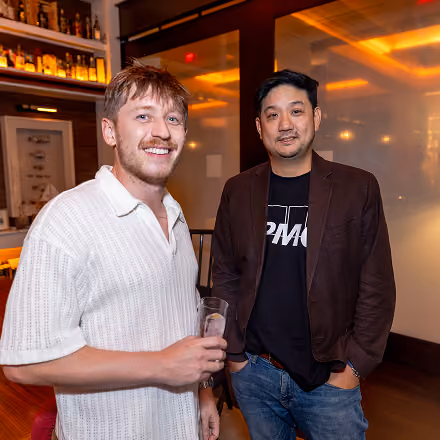 Two attendees networking at an OCF Institute finance and accounting event