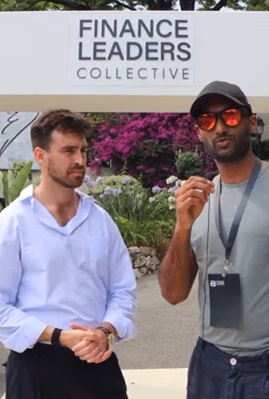 Two finance professionals speaking at a Finance Leaders Collective networking event hosted by OCF Institute