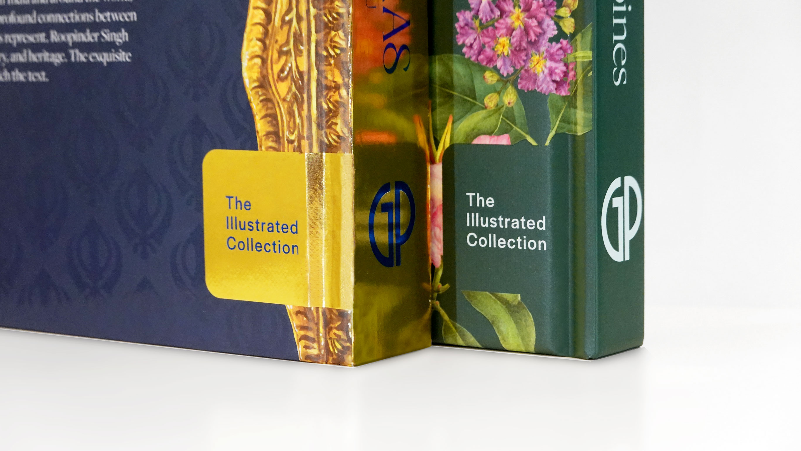 Close-up of two book spines labeled The Illustrated Collection with floral and gold decorative designs.