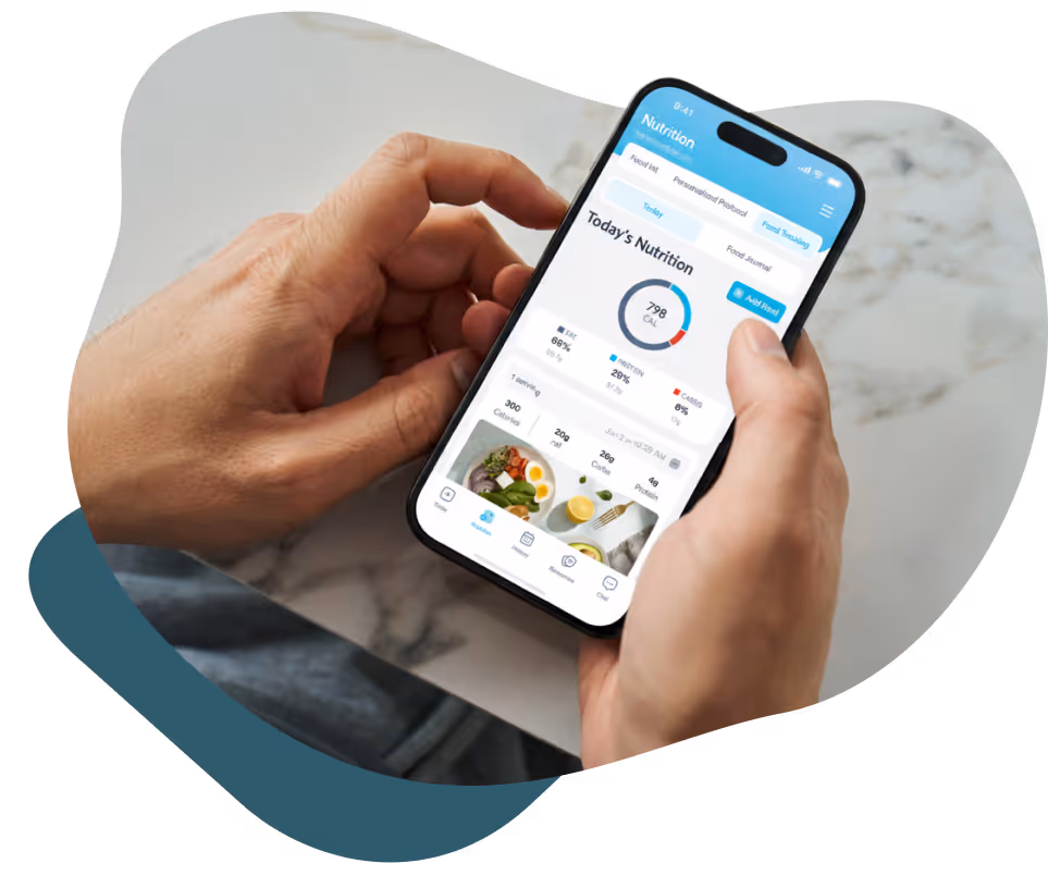 Hands holding smartphone displaying a nutrition app with calories and meal tracking details.