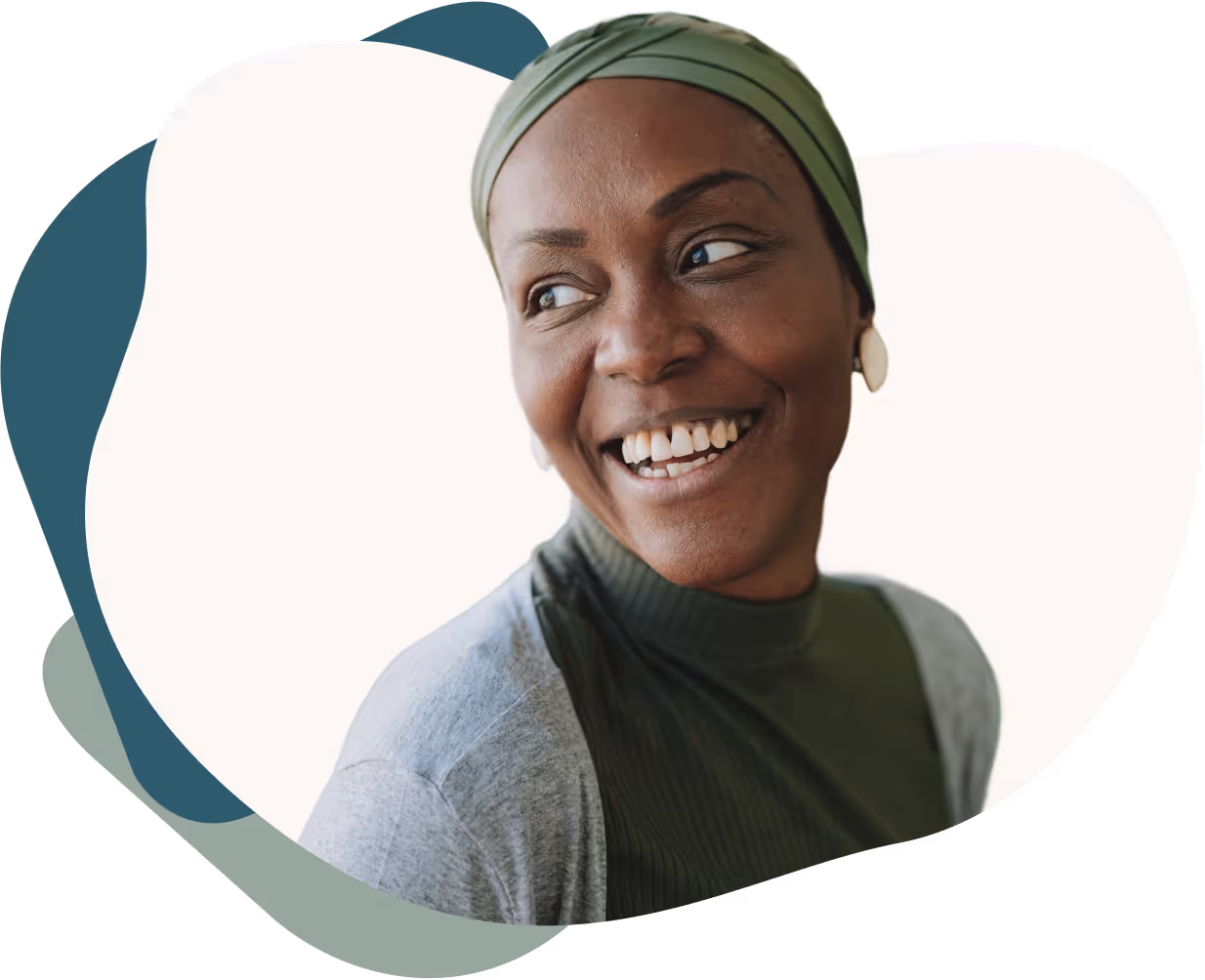 Smiling woman wearing a green head wrap, green ribbed top, and light gray cardigan.