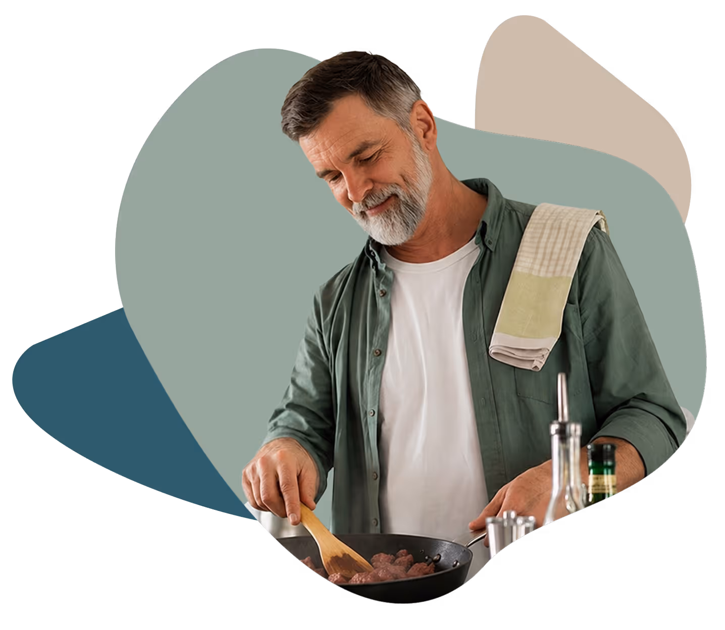 Middle-aged man stirring food in a pan with a wooden spatula, towel on shoulder.