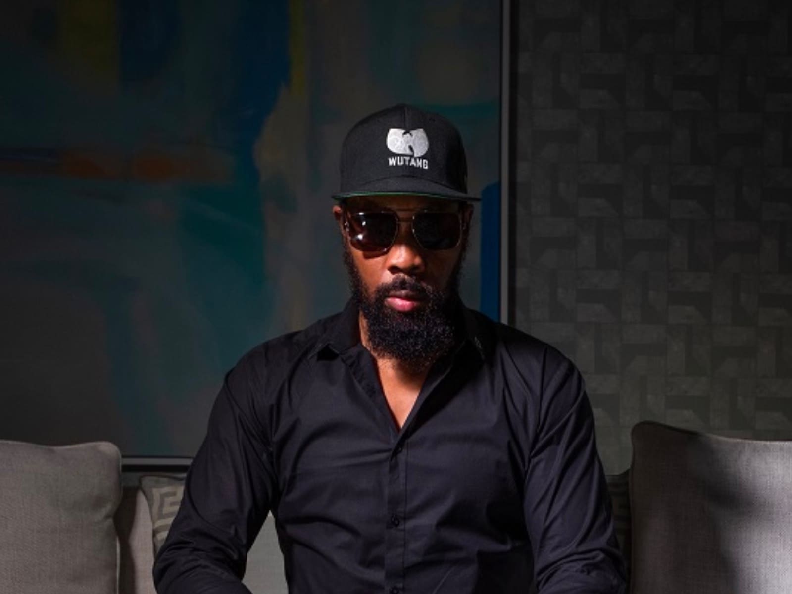 The Wu-Tang Clan’s RZA with Purling chess set on Chess Life Magazine cover