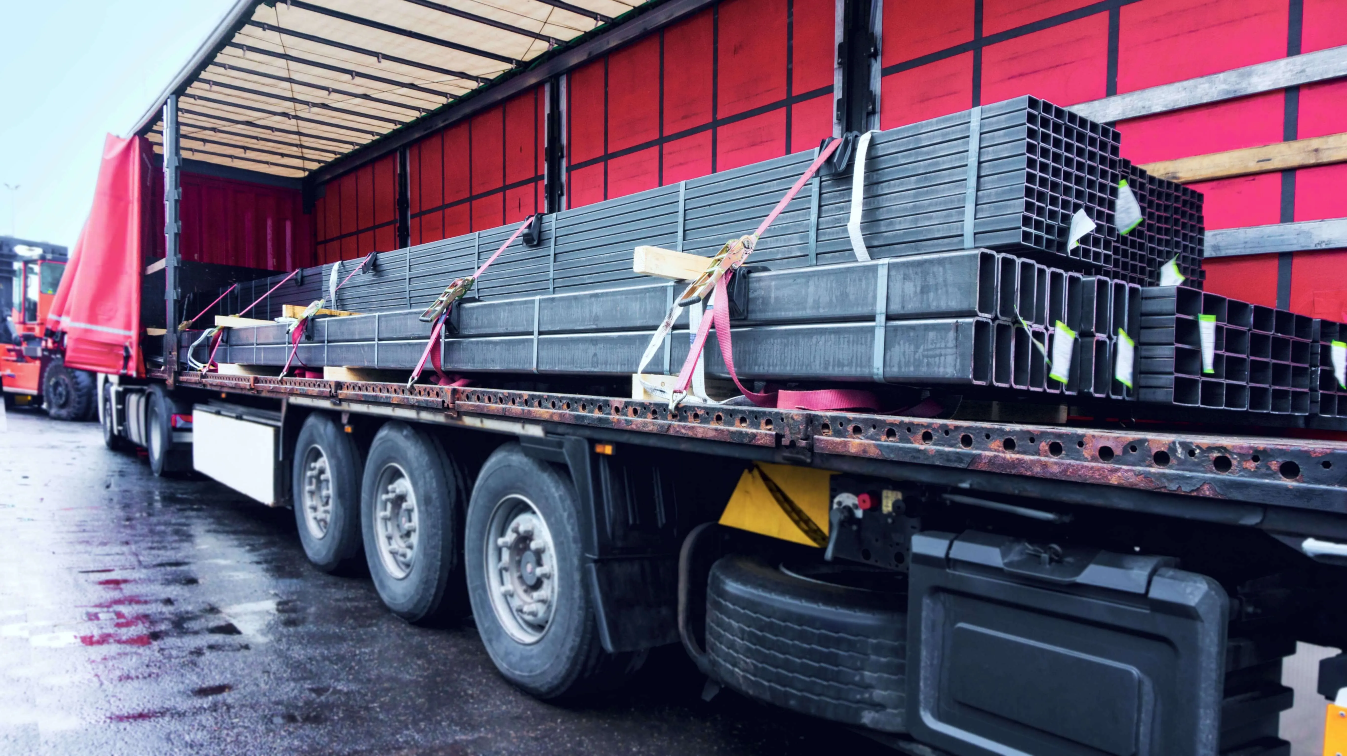 Steel strapped on a flatbed inside a warehouse