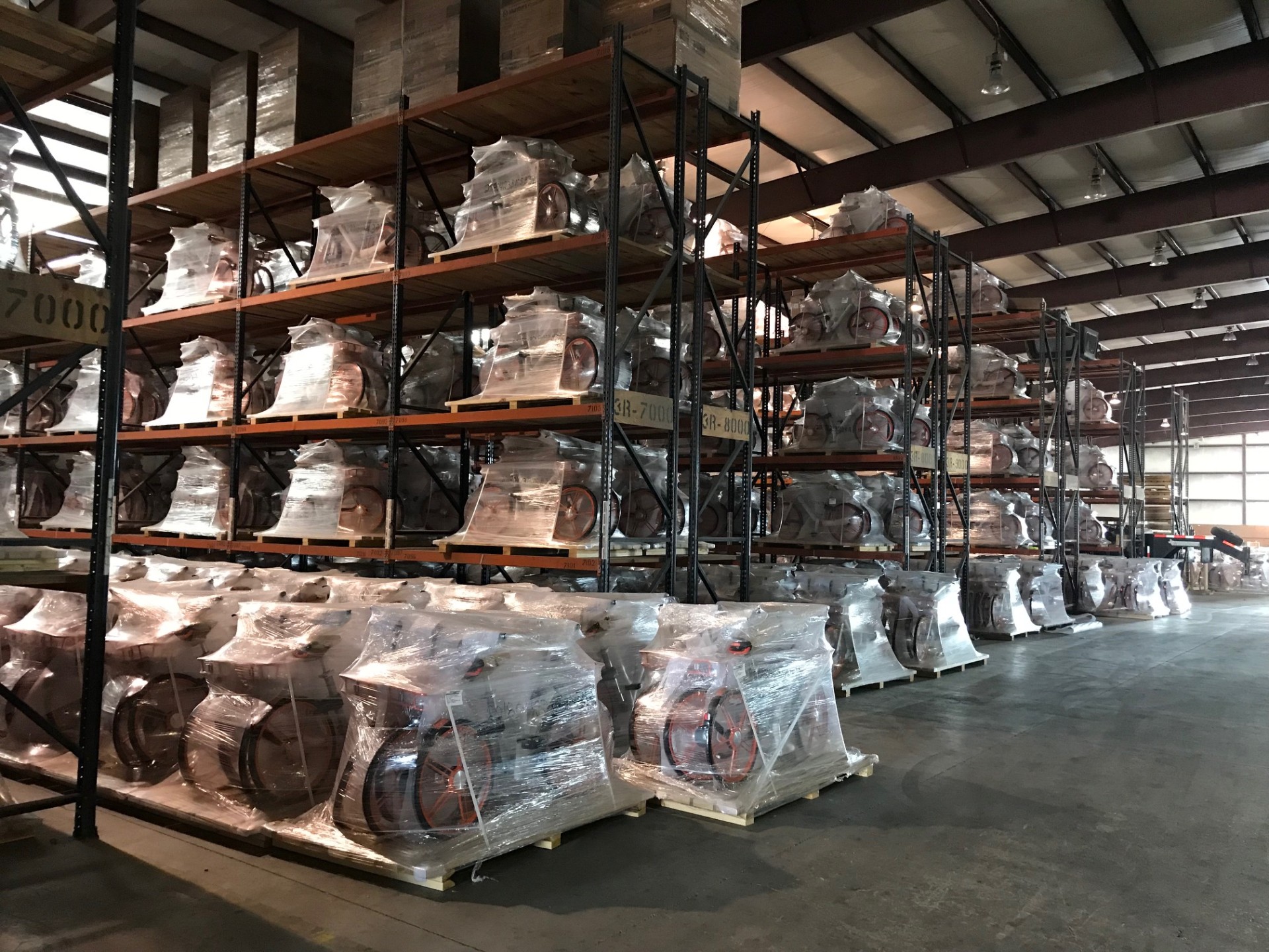 Electric bicycles wrapped and racked in the Baltimore holding warehouse
