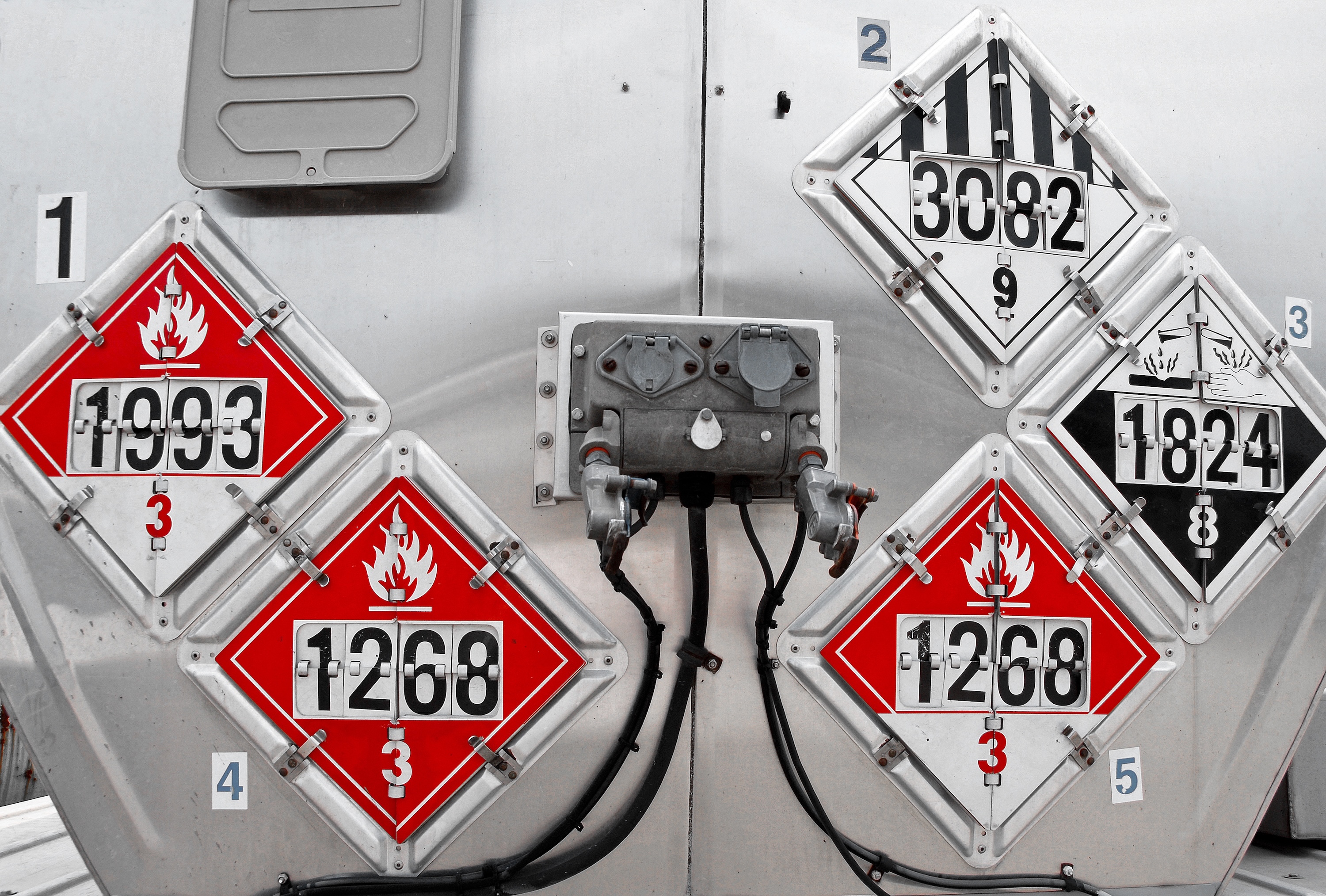 Row of stainless chemical tankers staged at a tank yard