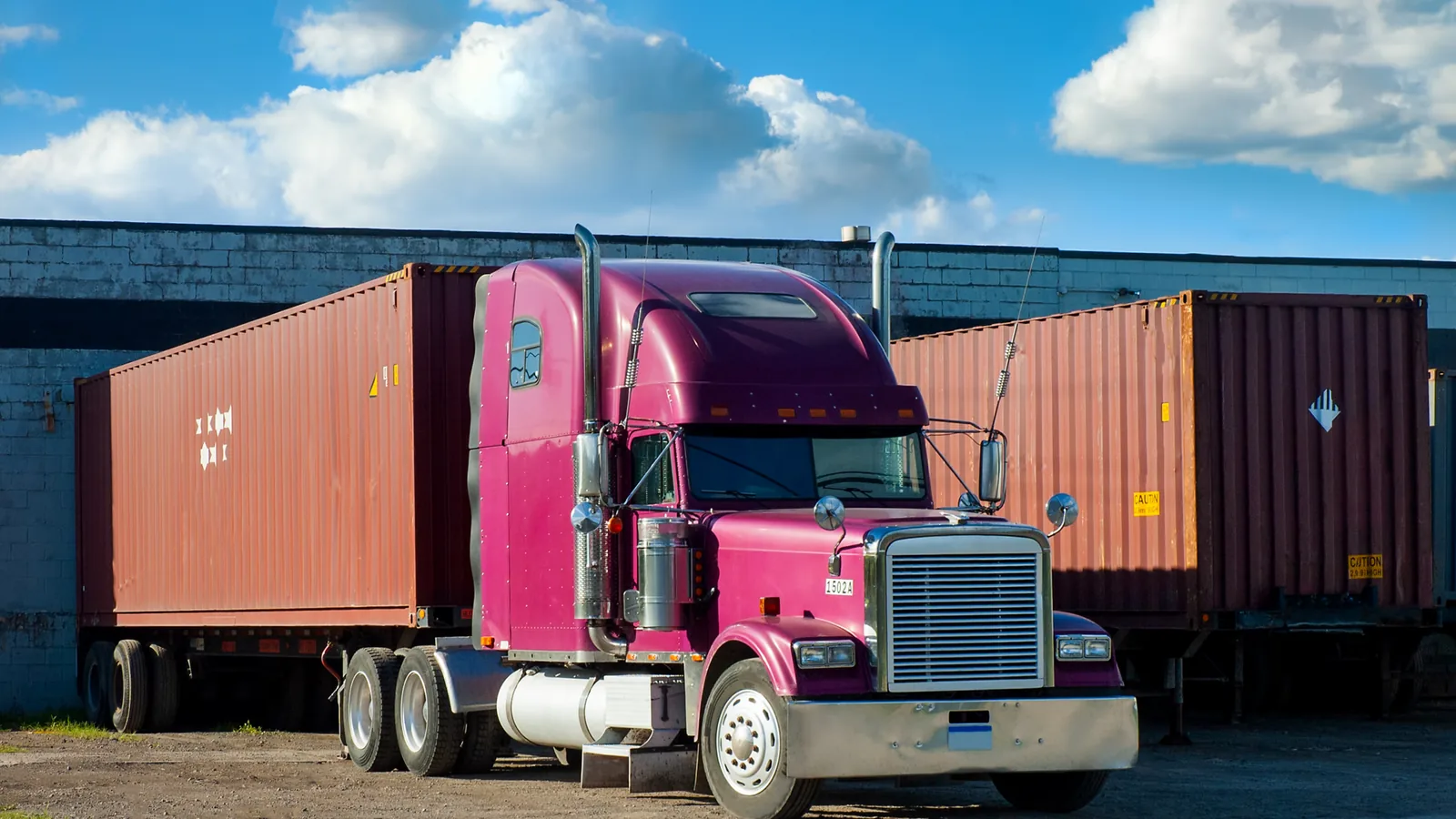 Loaded shipping container on a chassis parked at a yard