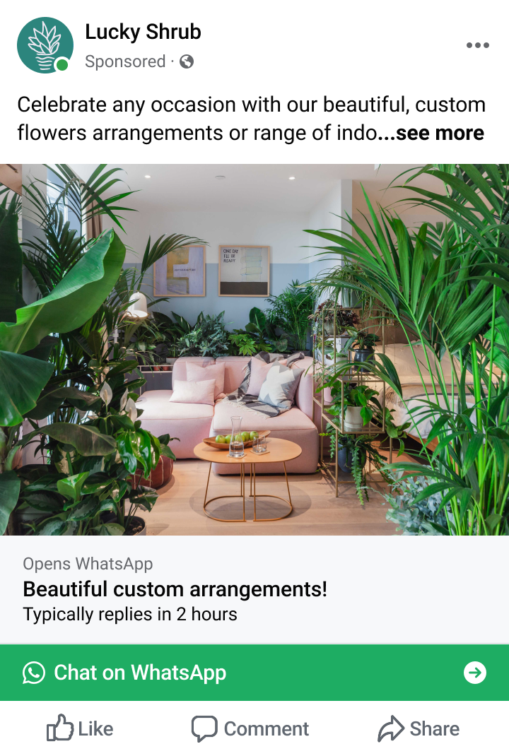 Cozy living room with pink sofa, wooden coffee tables, and abundant green indoor plants around the space.