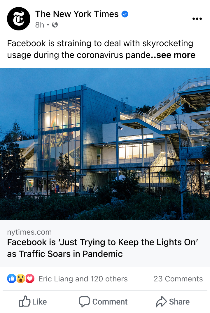 Facebook corporate building at dusk with interior lights on, shared in a New York Times post about traffic soaring during the pandemic.
