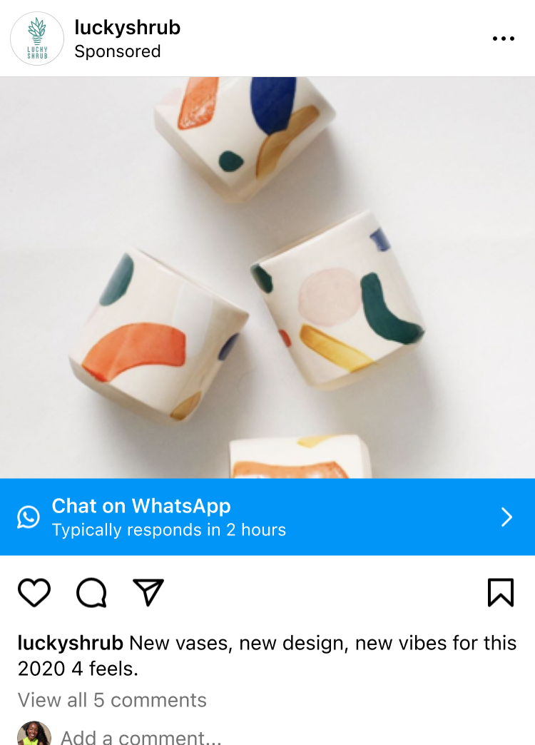 Four ceramic vases with abstract shapes in orange, blue, green, pink, and yellow on a white background, displayed for sale on an Instagram post by luckyshrub.