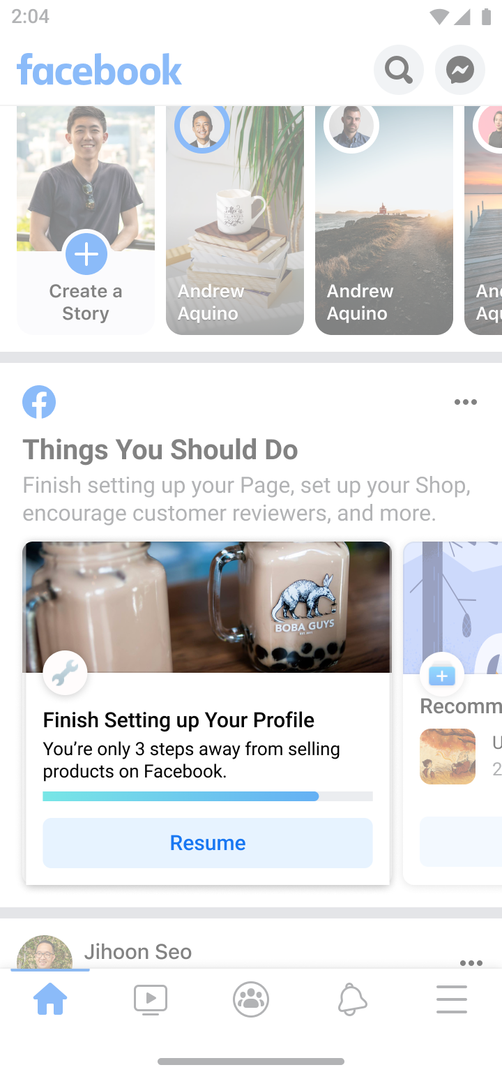 Facebook app interface showing story creation option, user stories of Andrew Aquino, and a prompt to finish setting up profile with a boba tea image and a resume button.