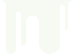 White liquid dripping in irregular rounded streams on a light background.