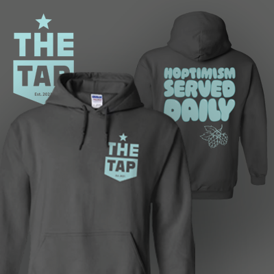 Charcoal hoodie with light blue 'THE TAP Est. 2023' logo on front and 'HOPTIMISM SERVED DAILY' text with hop graphic on back.
