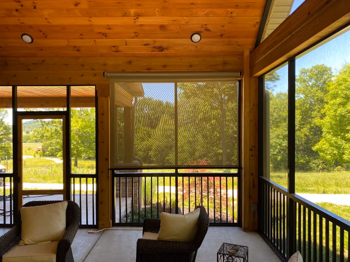 Motorized retractable screen enclosing a patio