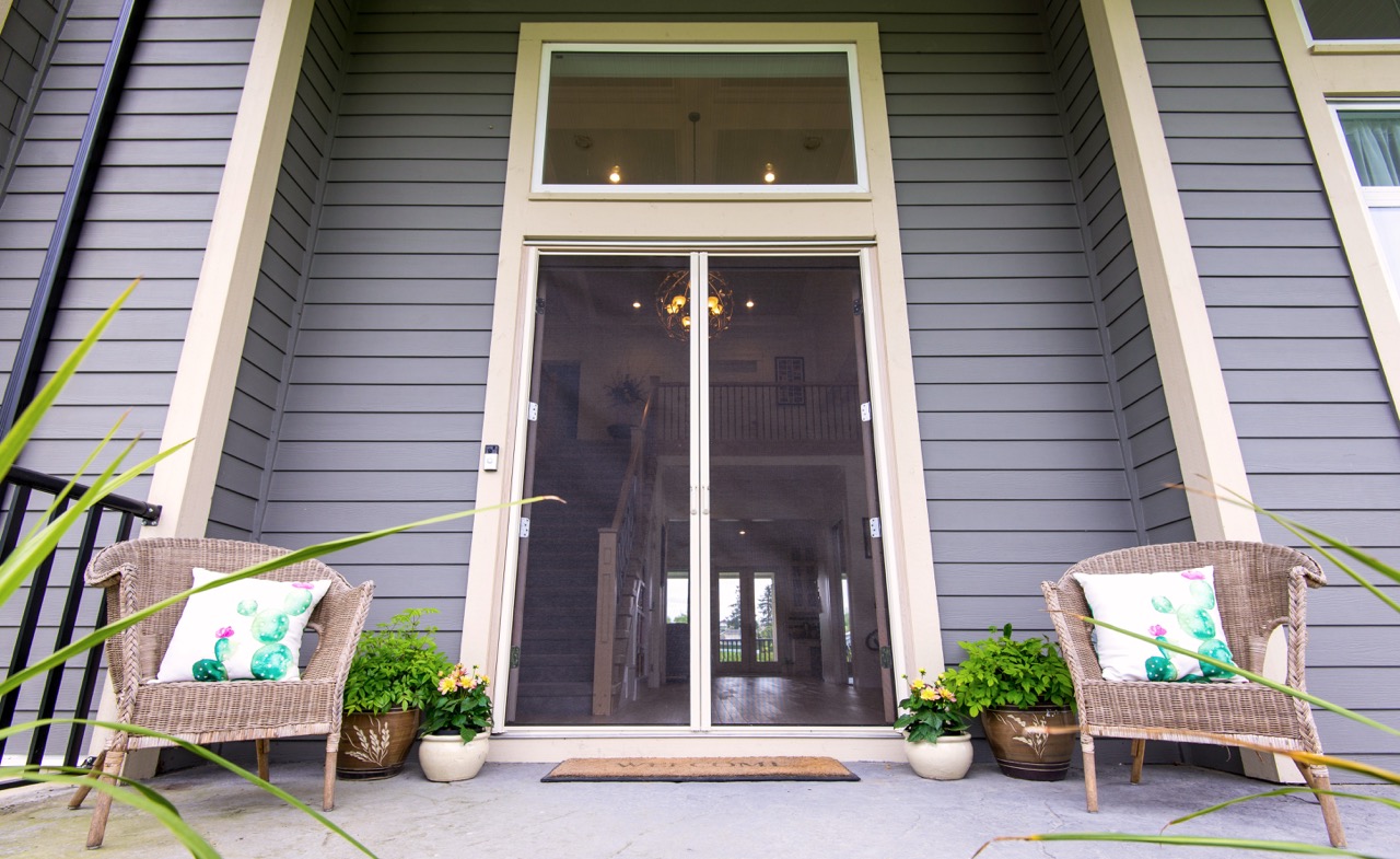 Retractable screen enclosing a home's back porch