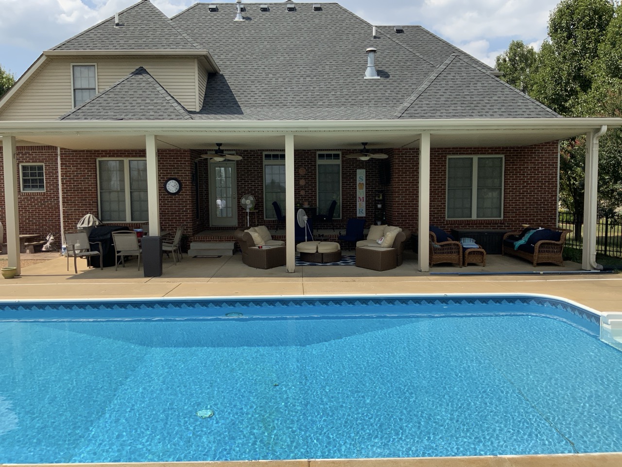 Covered patio and pool at a residential home