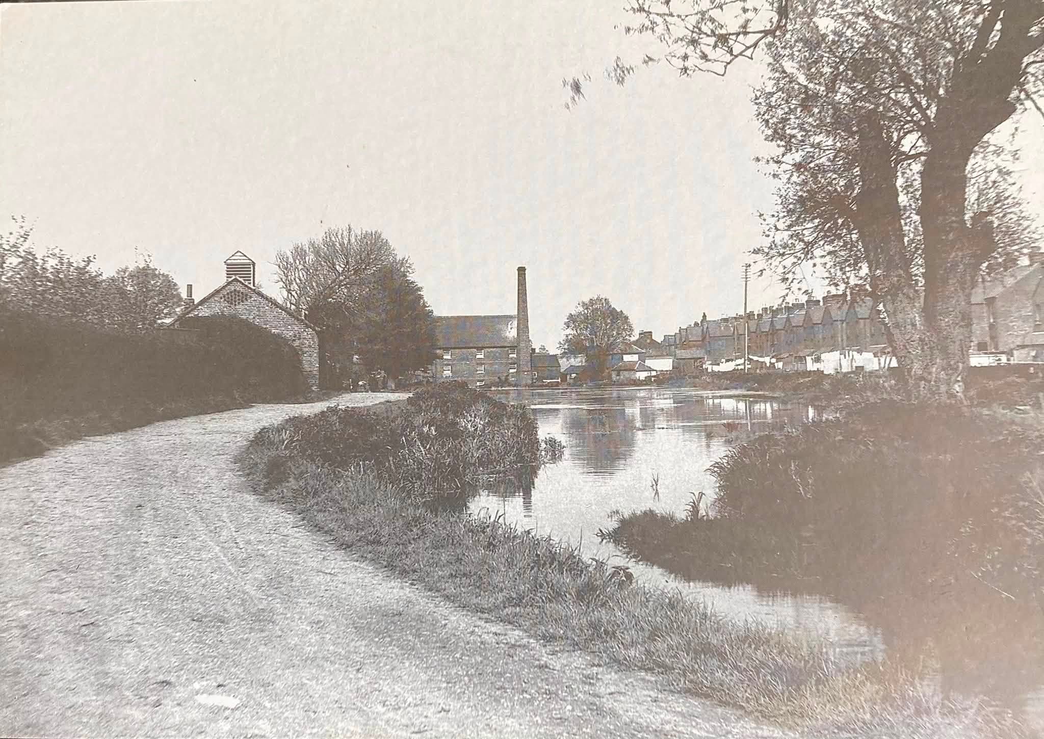 The caption that accompanied this photograph described it as “Bone Mill Pond” in 1906 that was in Westminster Lane, Newport.